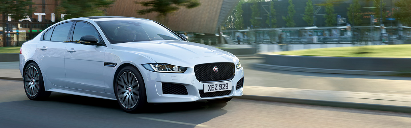 2019 Jaguar XE - White - Exterior - Driving on the road