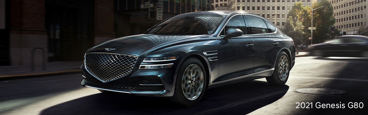 2021 Genesis G80 driving through a city