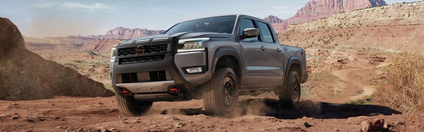 2025 Ford F-150 vs. Competition Black color car on moutain Front View