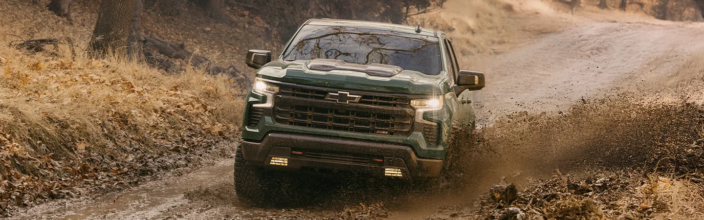 2025 Ford F-150 vs. Competition Green color car offroading View