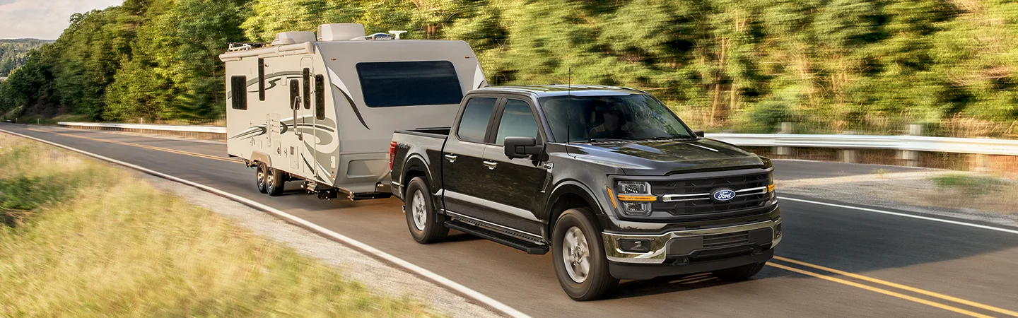 Balck 2025 Ford F-150 with with campervan
