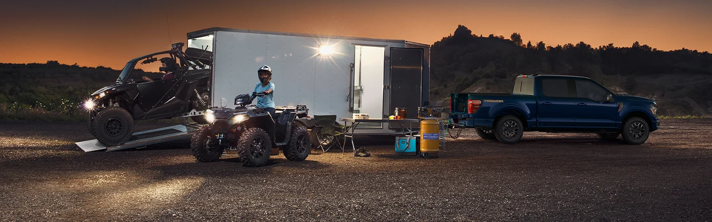 blue 2025 Ford F-150 night camping