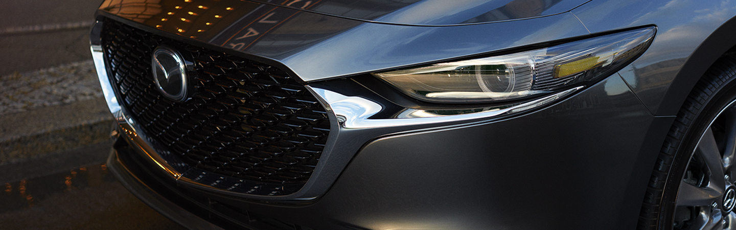 Two 2019 Mazda CX-9 vehicles in motion outside of Werner Mazda