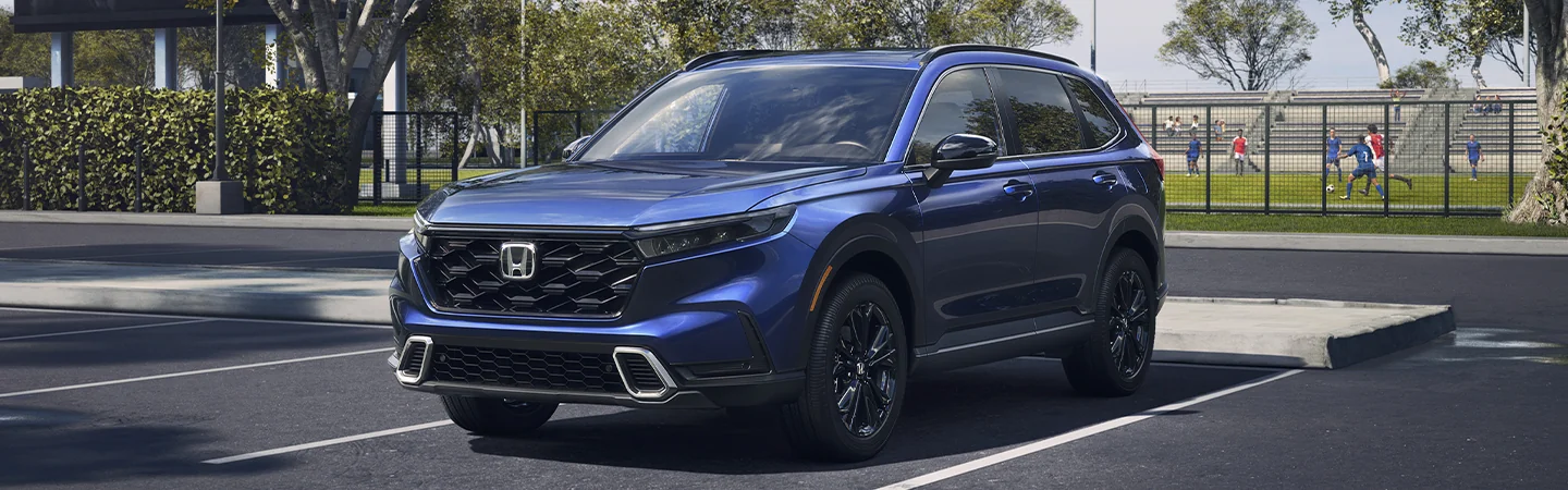 Blue 2025 Honda CR-V stands Outside the ground