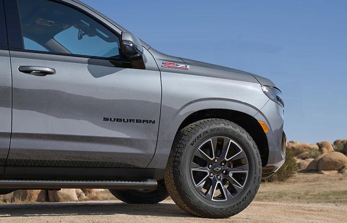 A view of a parked sliver 2022 Chevrolet Suburban tire