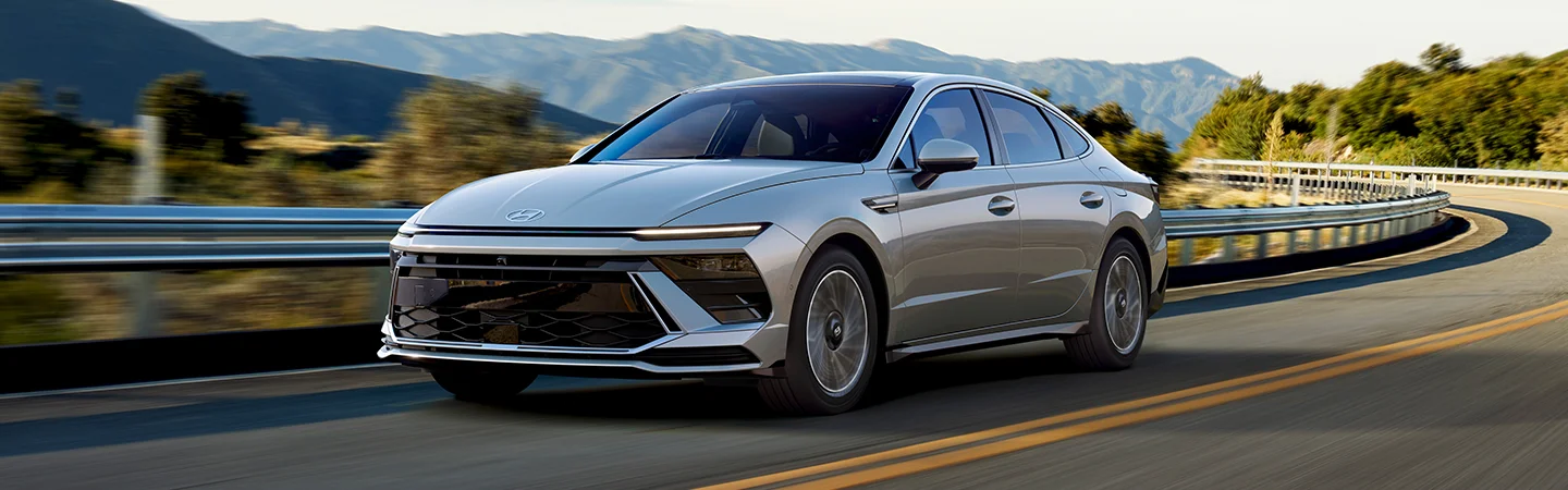 white grey Toyota Camry driving