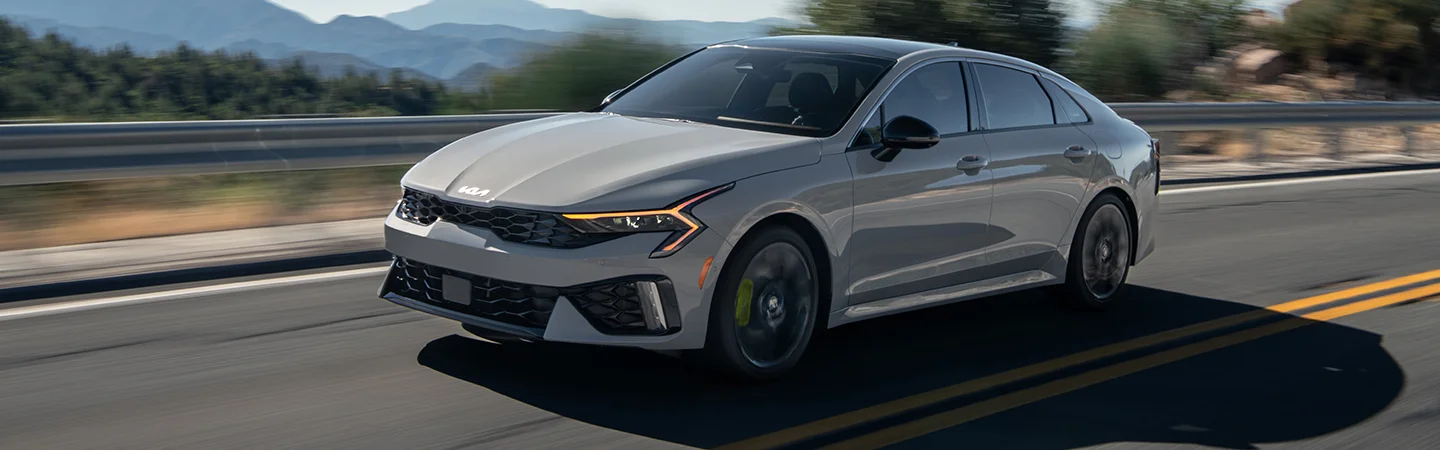 grey Toyota Camry driving