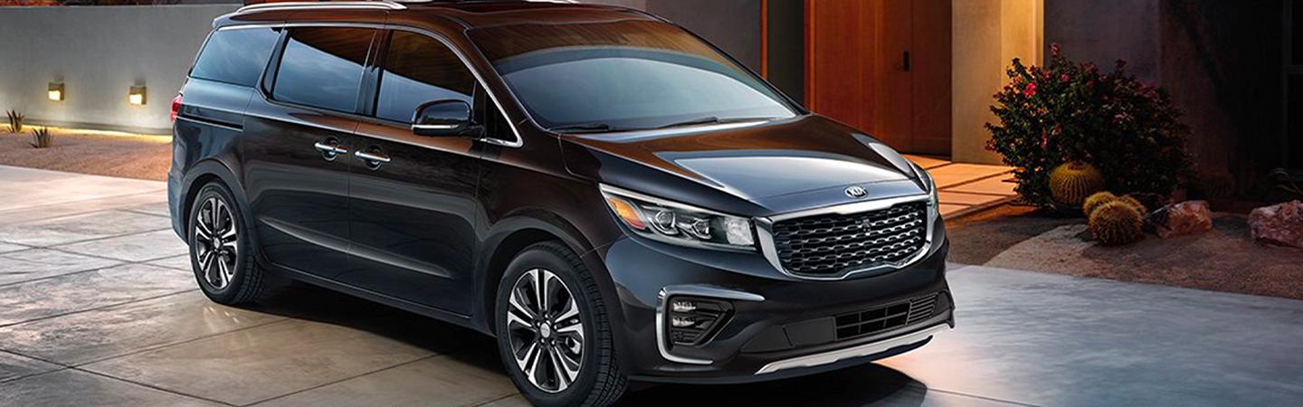 Black 2020 Kia Sedona parked in driveway