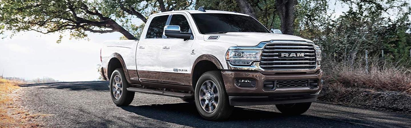 White RAM truck in motion