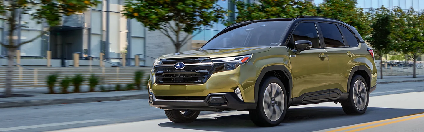 2025 Subaru Forester Hybrid Green Color city on the road car front View in Leesburg, FL