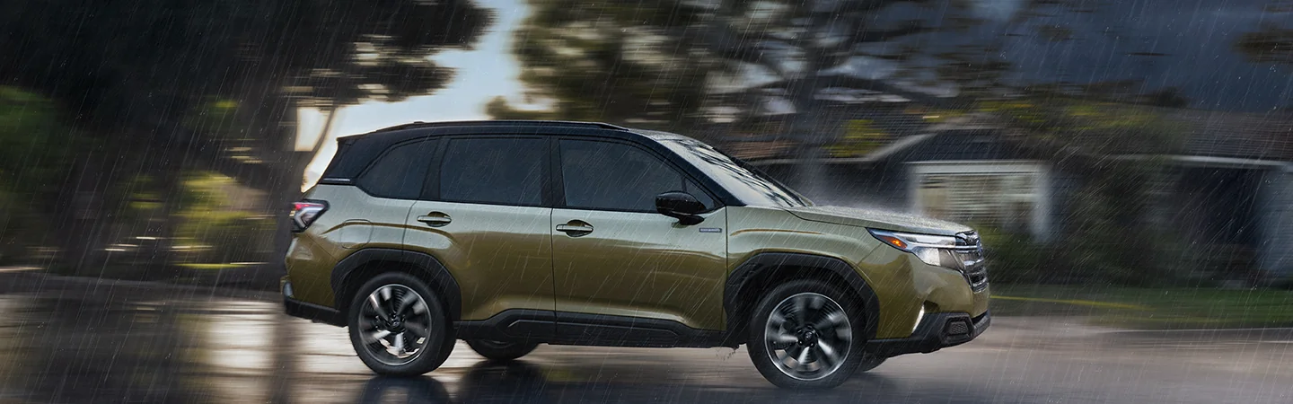 2025 Subaru Forester Hybrid Green color car side View Raine weather in Leesburg, FL