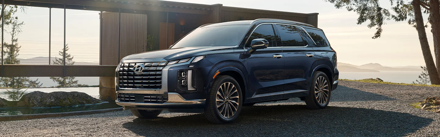 2025 Toyota Highlander Comparison Blue Color stand Front View 