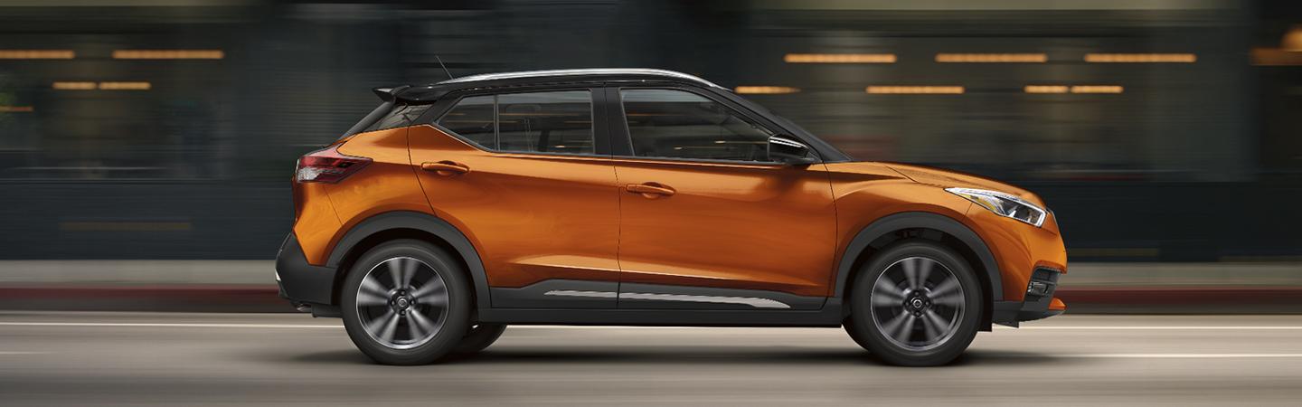 Side view of the orange metallic 2020 Nissan Kicks
