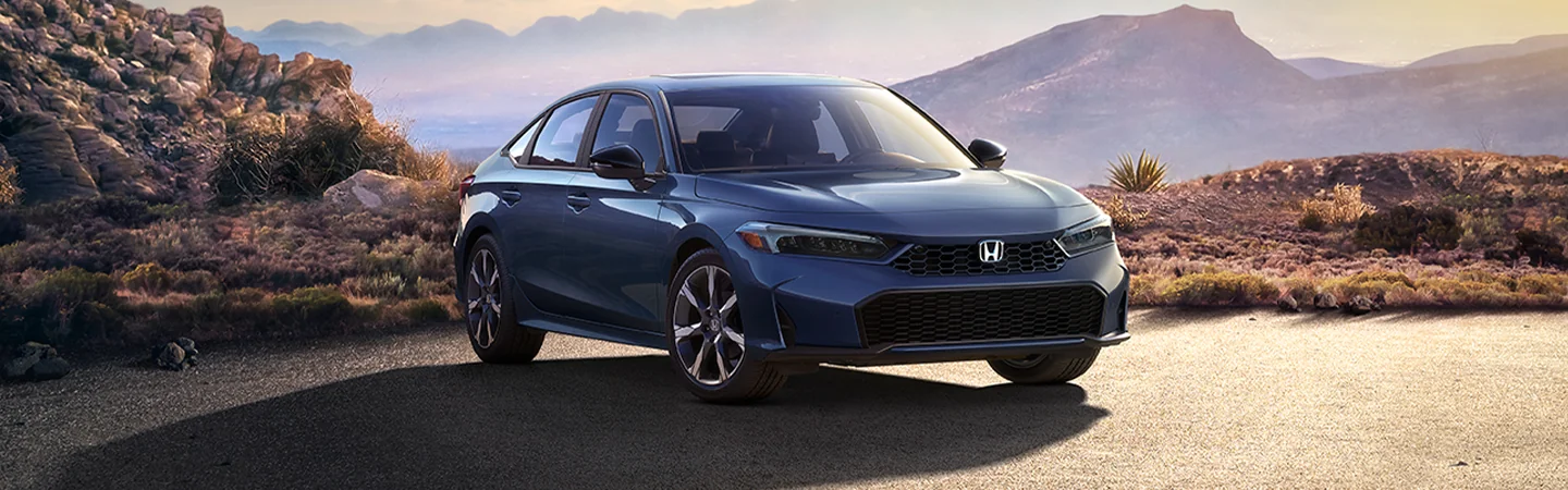 The 2025 Honda Civic Sport is a between mountains