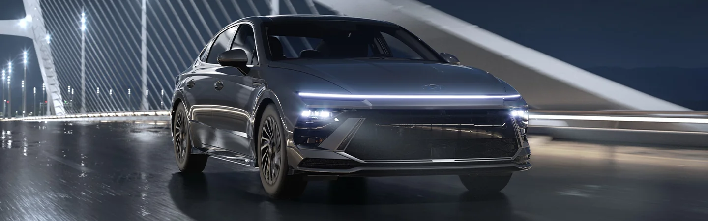 Blue 2025 Hyundai Sonata parked on a bridge