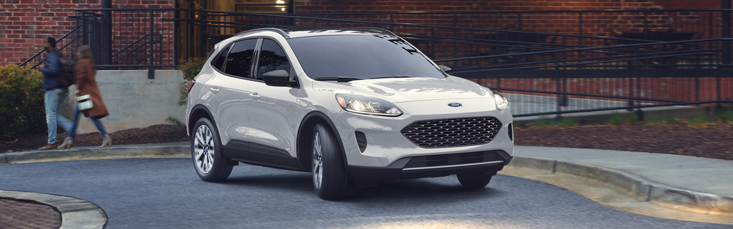 White 2020 Ford Escape turning on the road