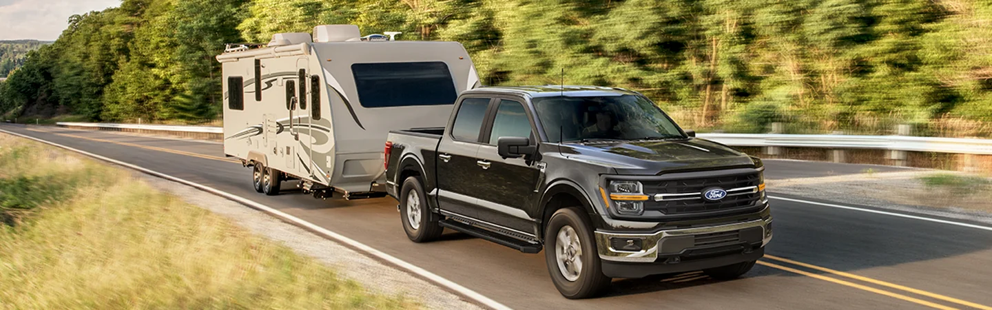 2025 Ford F-150 Raptor® towing a camper