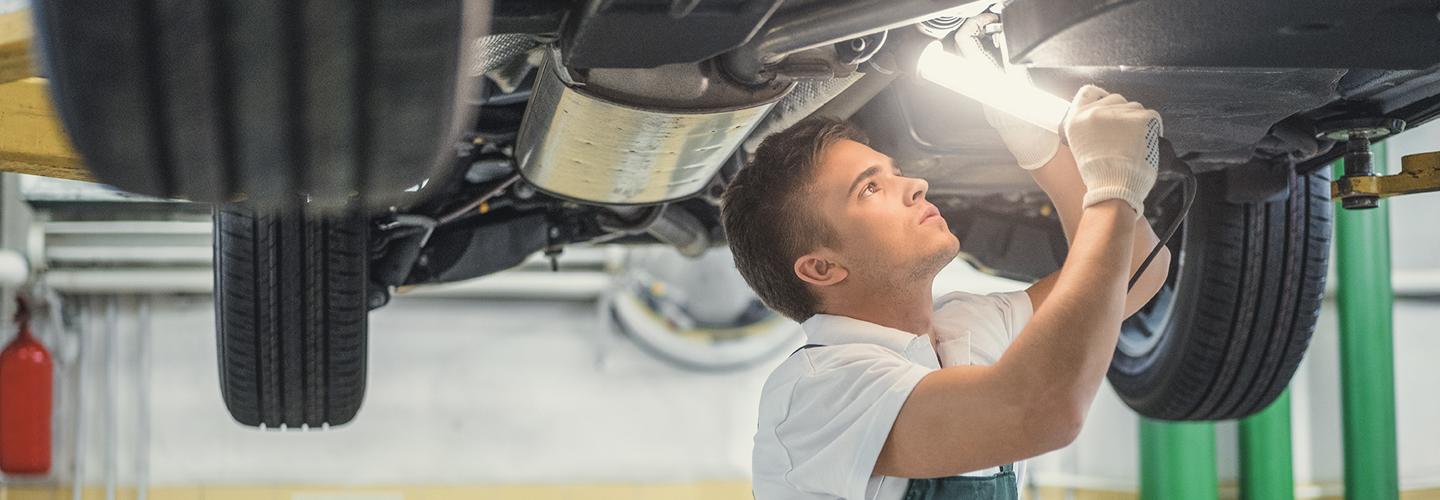 Technician performing auto repair service