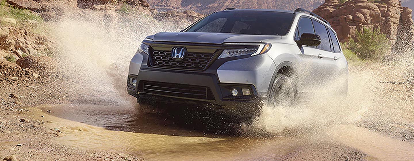 2019 Honda Passport crossing a river.