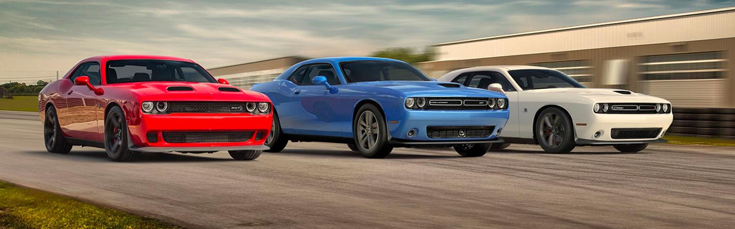 Three 2020 Dodge Challenger models in motion