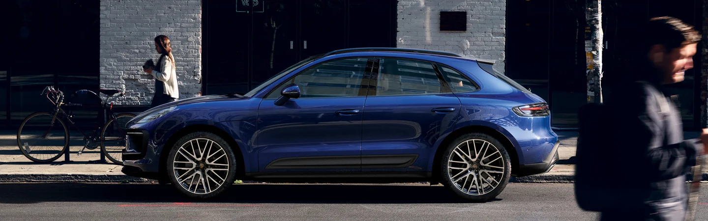 side of blue Porsche Macan