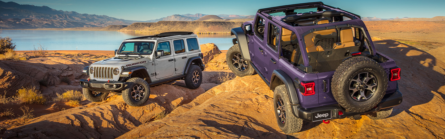 2024 Jeep Wrangler vs. Ford Bronco silver frontview