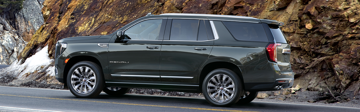 Side view of the 2021 GMC Yukon in motion