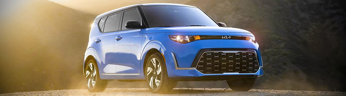 new blue Kia Soul in the breaking dawn