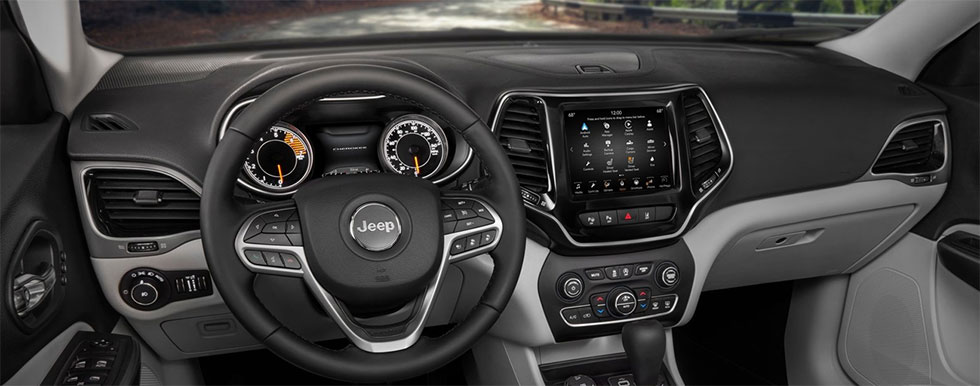 Safety features and interior of the Jeep Cherokee - available at our car dealership near Edmond.