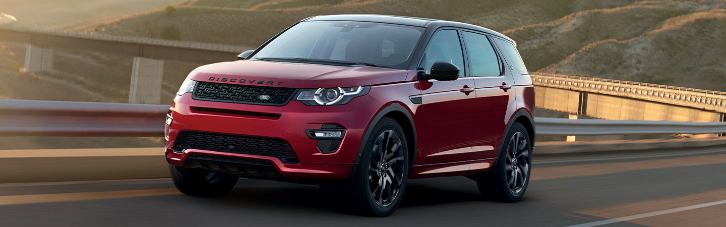 Red Land Rover Discovery Sport in motion