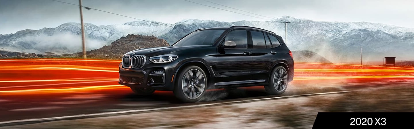 Black 2020 BMW X3 in motion