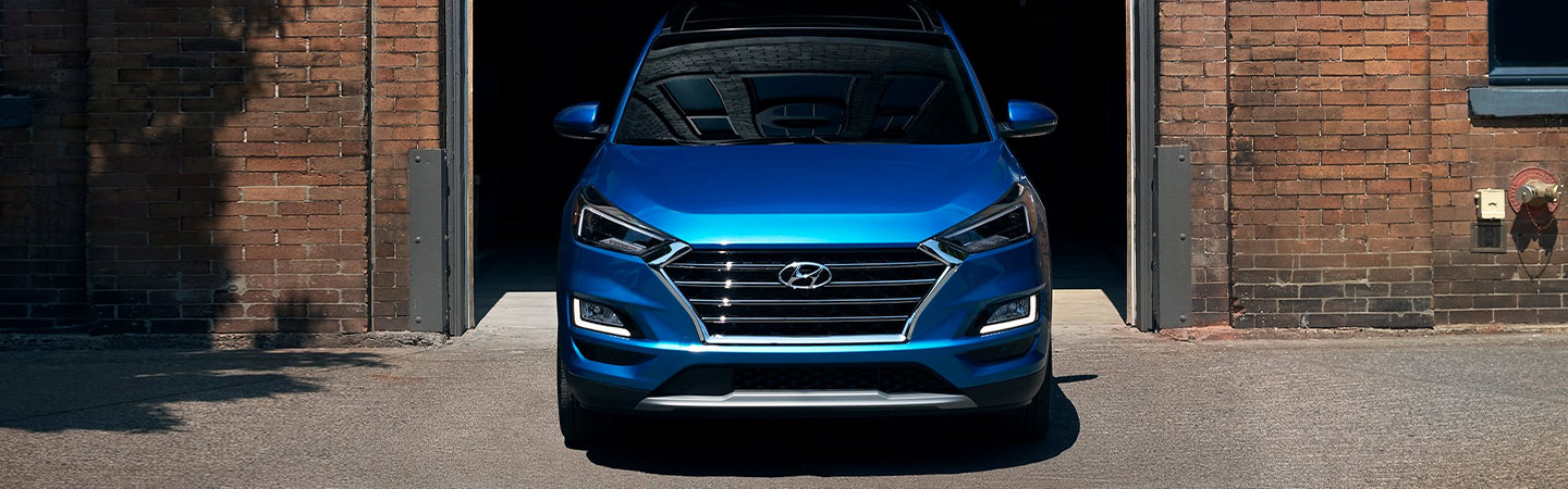 Front of blue Hyundai Tucson
