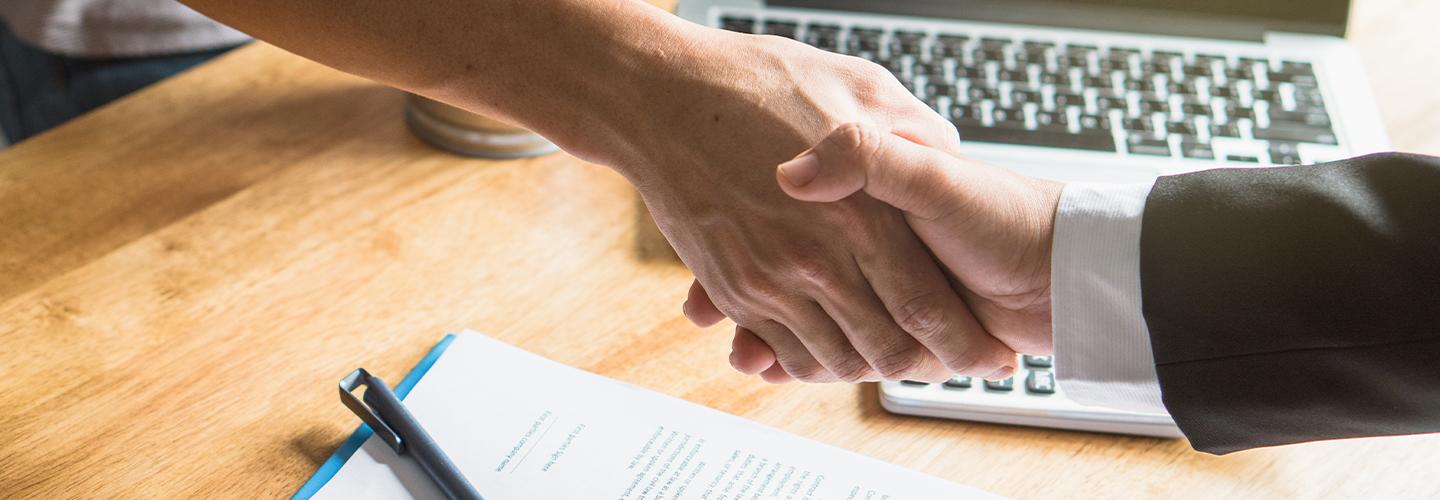A handshake on making an auto deal