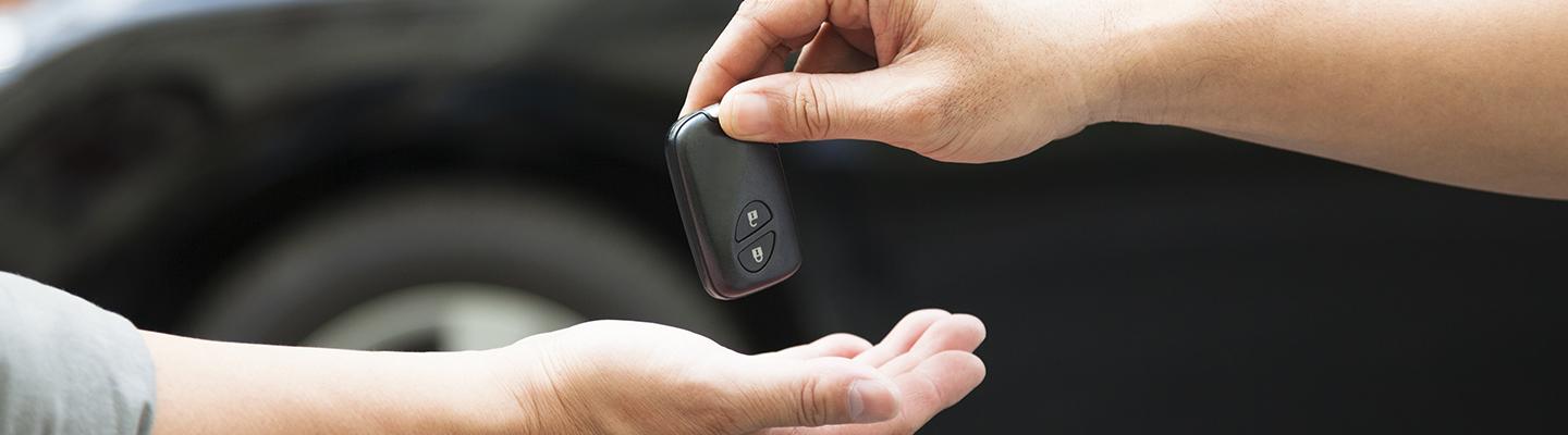 keys being passed from one person to another