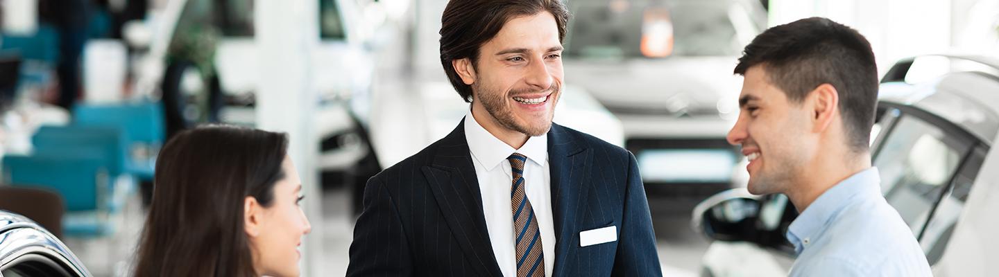 Sales person with man and woman