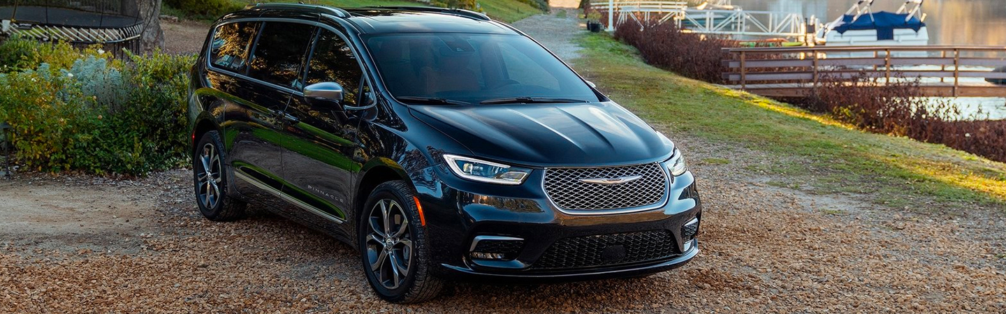 Side view of the 2021 Chrysler Pacifica driving 