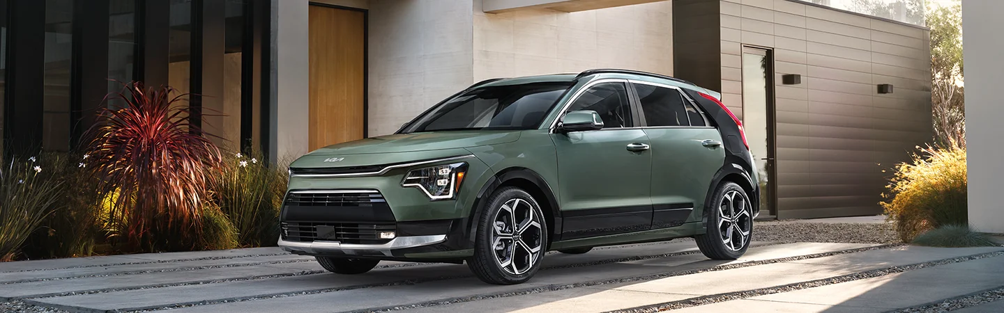 2025 Kia Niro parked in front of a home
