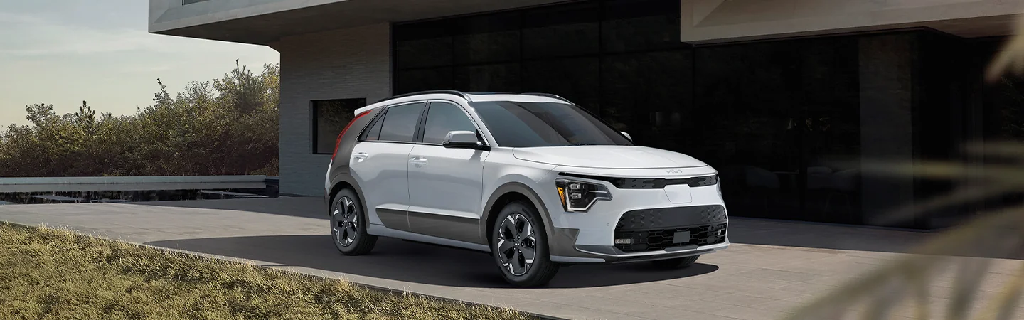 2025 Kia Niro parked in front of a building