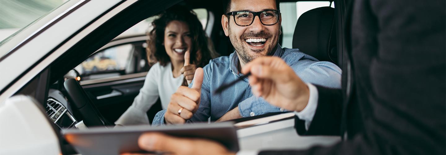 Close up of a couple financing their first Ford vehicle