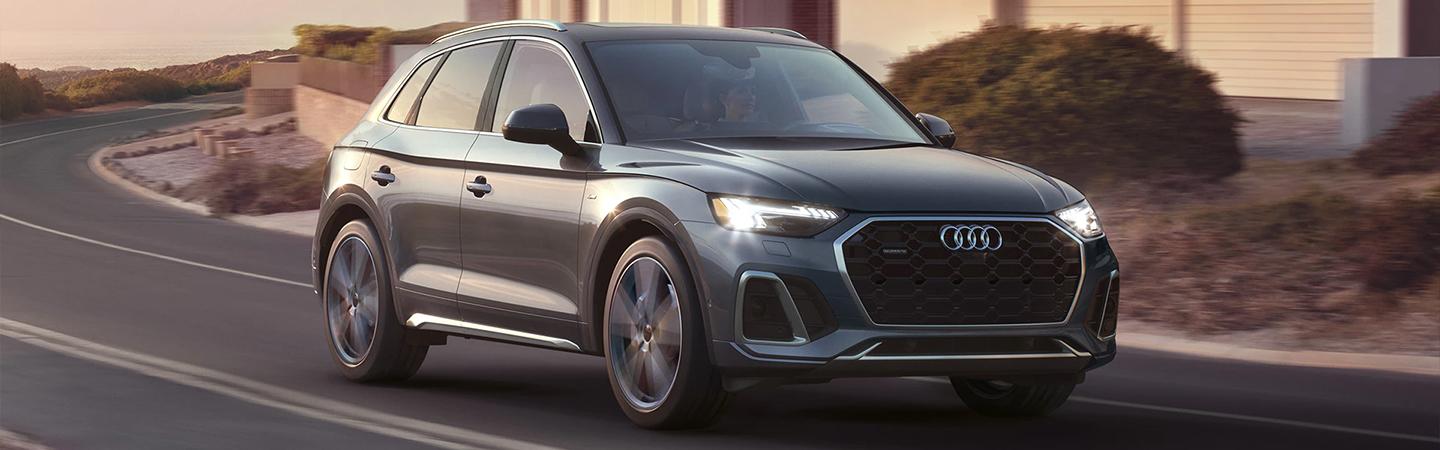 A silver Audi SUV in motion
