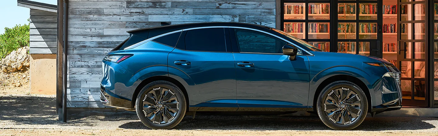 2025 Nissan Murano parked in front of a building