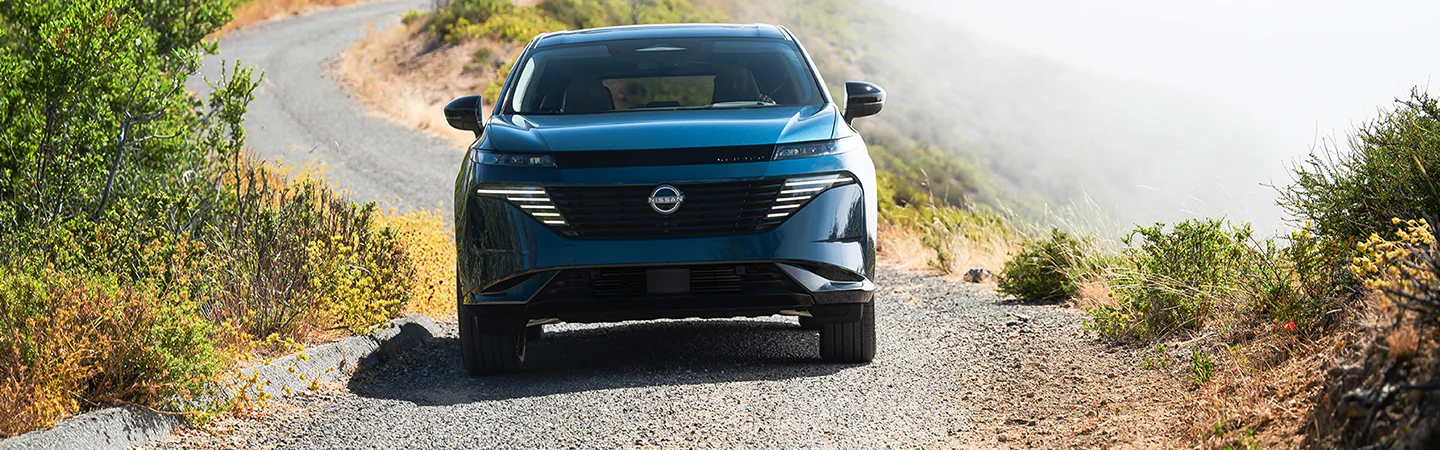 2025 Nissan Murano driving down a gravel road