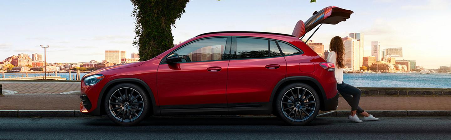 Side view of a red 2021 Mercedes-Benz GLA 250 with the trunk open