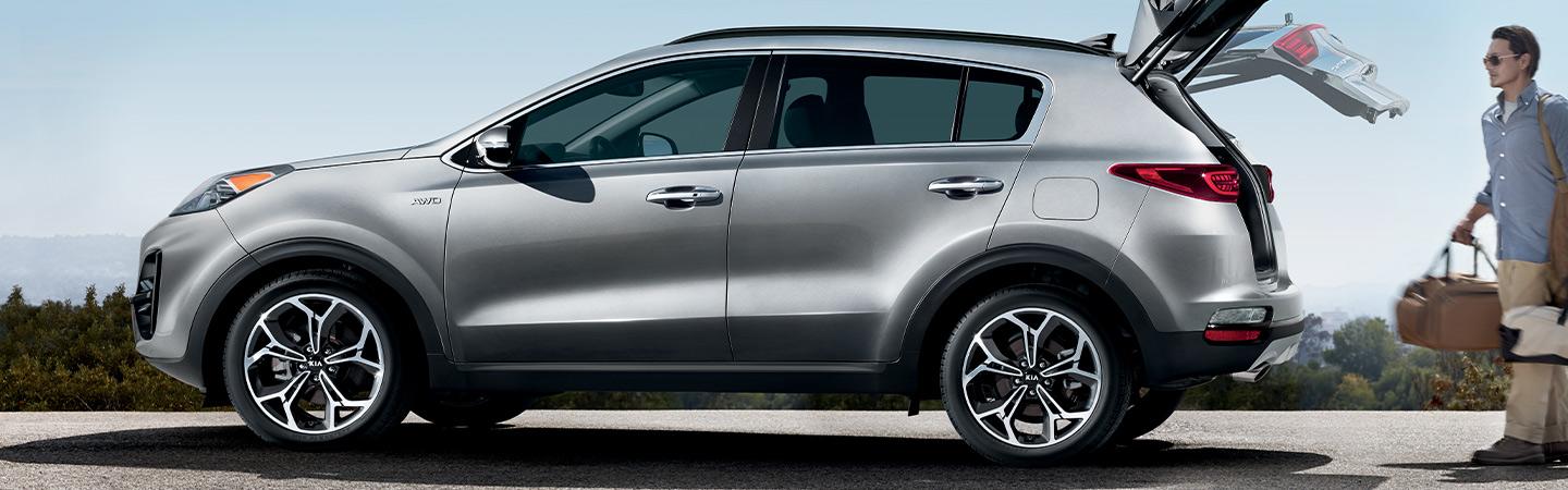 Silver Kia Sportage with hatch open.