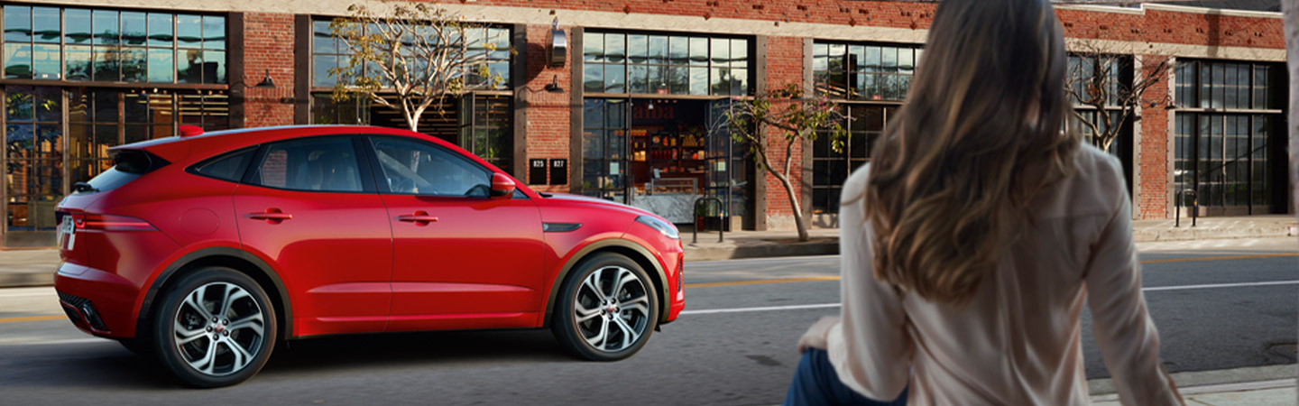 Red Jaguar E-PACE on city road