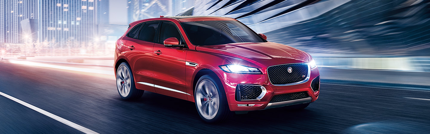 Red Jaguar F-PACE in motion