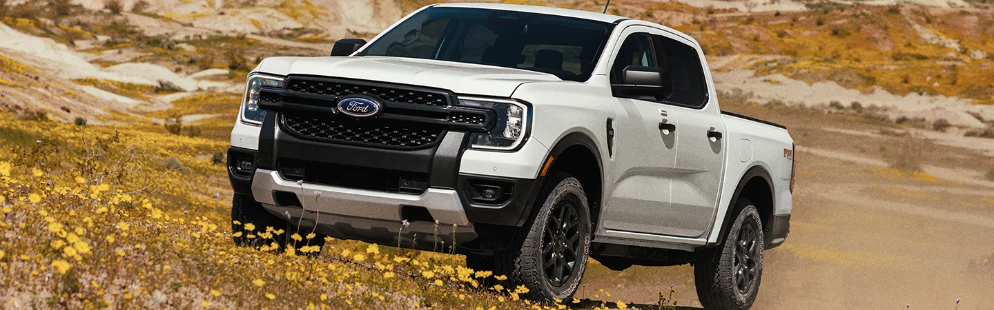 front view of a white 2025 Ford Ranger Raptor offroad