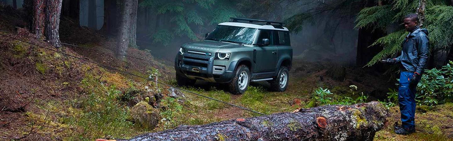 2021 Land Rover Defender parked in the woods