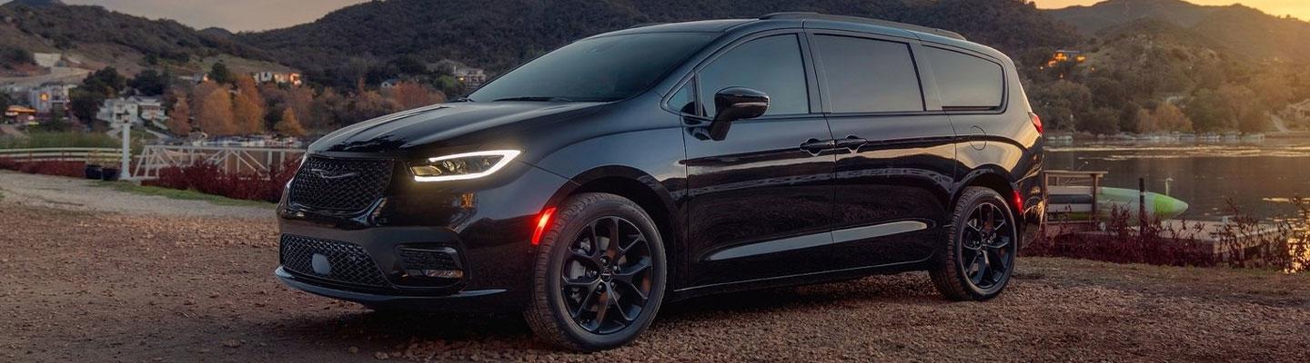 Black 2021 Chrysler Pacifica parked near a lake