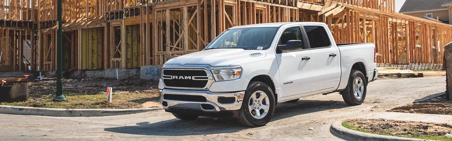 White RAM 1500 parked near construction zone